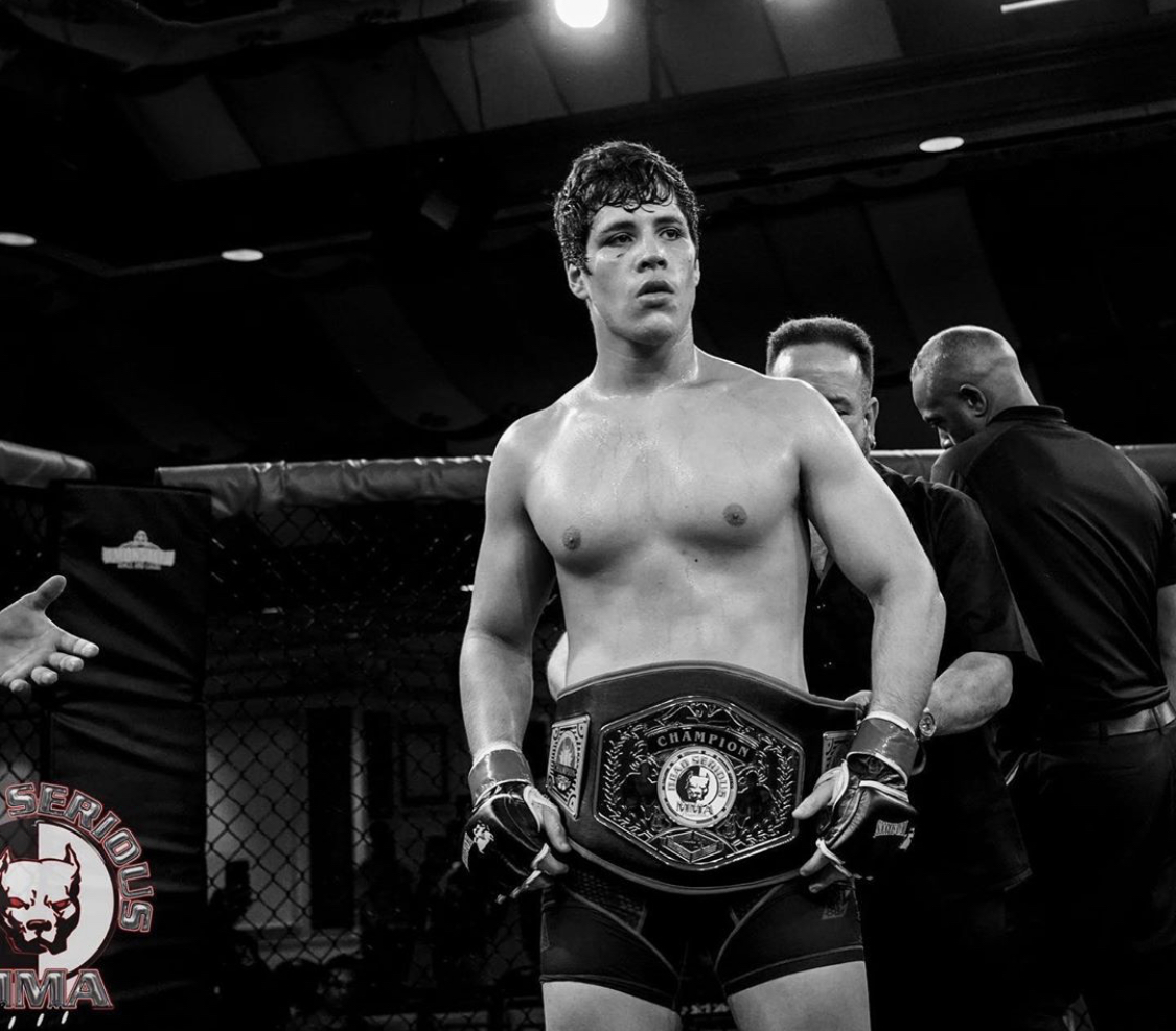 Johnny Santos with the Dead Serious MMA middleweight belt